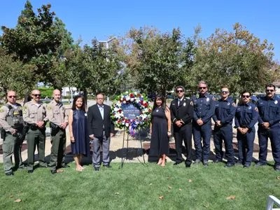 Photo featuring Cerritos Sheriff's Station deputies and firefighters with the Los Angeles County Fire Department Station 30 with the Cerritos City Council at the Patriot Day observance on September 11, 2026.