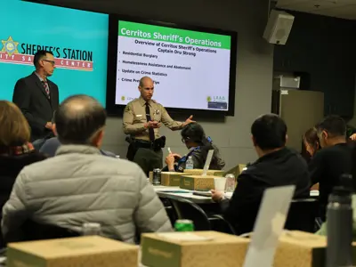 Cerritos Sheriff's Station Captain Dru Strong (pictured on the right), presents to L.E.A.D. Cerritos members on February 19, 2026. 