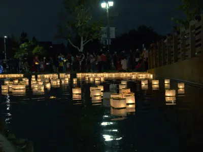 Lanterns on the water during 2022 festival at Cerritos Heritage Park